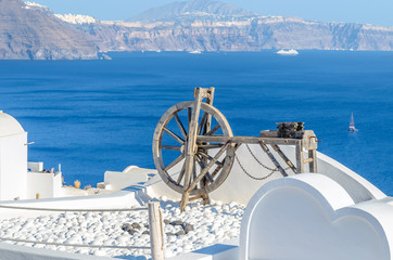 Spinning wheel  in the stunningly beautiful town of Oia