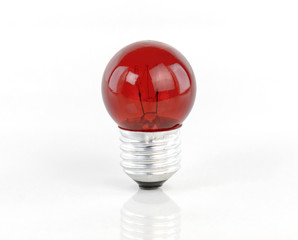 Red light bulb isolated on white background