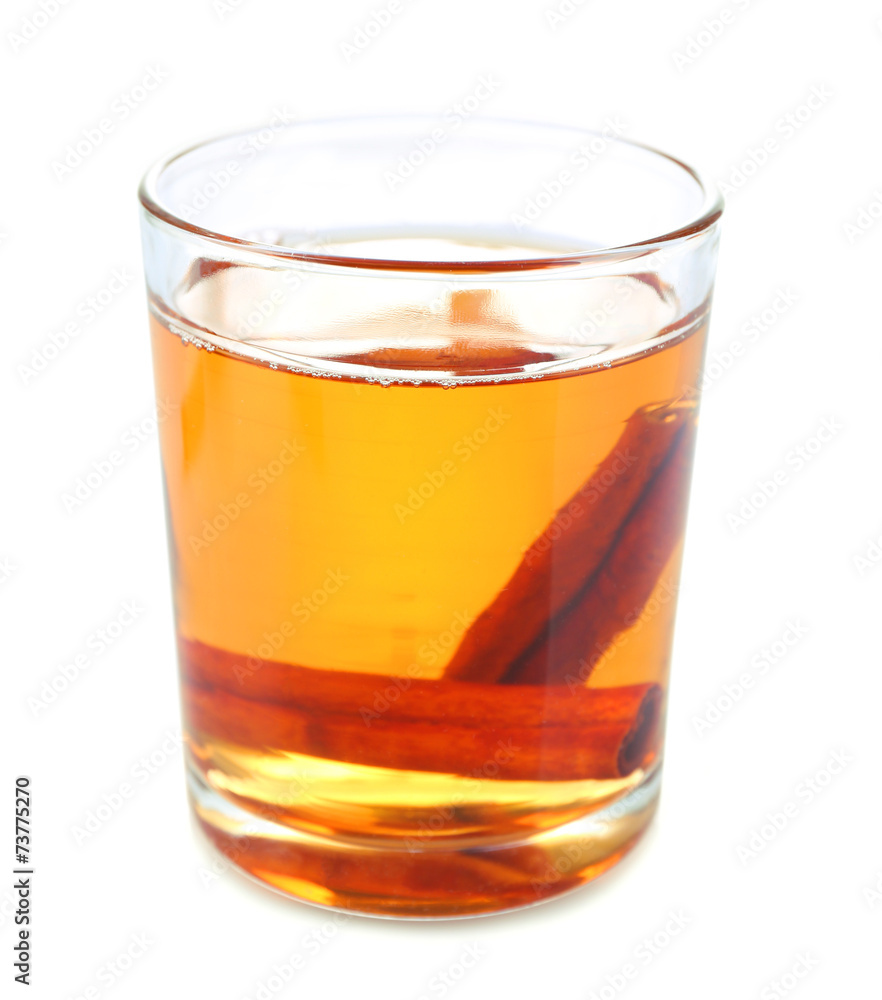 Apple cider with cinnamon sticks, isolated on white