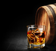 Glass Of Cognac On The Vintage Wooden Barrel