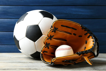 Poster - Sports balls on wooden background