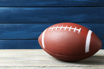 Wall Mural - Rugby ball on wooden background