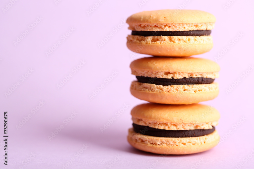Gentle colorful macaroons on color background