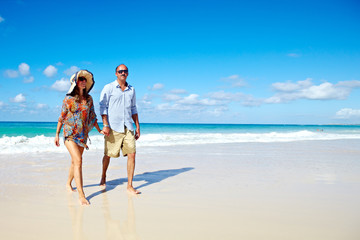 Loving couple relaxing on beach