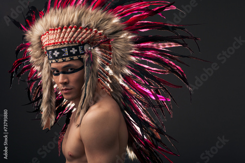 Fototapeta na wymiar Indian strong man with traditional native american make up