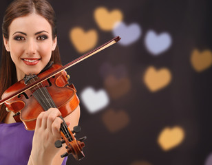 Wall Mural - Beautiful young girl with violin on bright background