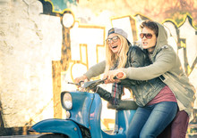 Young Couple In Love Haviing Fun On A Vintage Scooter Moped