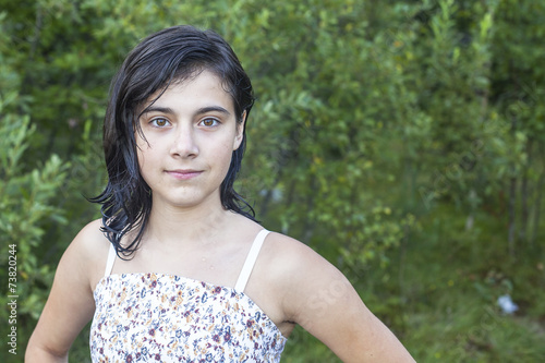 Fotografia, Obraz Portrait of a young dark-haired girl, in the park outdoors.