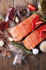 Wall Mural - Fresh salmon with spices on wooden table
