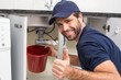 © WavebreakMediaMicro - Plumber fixing under the sink