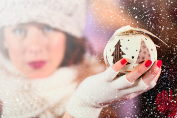 Wall Mural - girl holding a xmas tree decoration