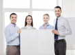 © Syda Productions - business team in office with white blank board