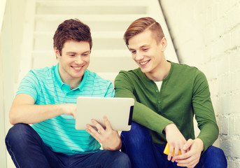 Wall Mural - smiling male students with tablet pc computer