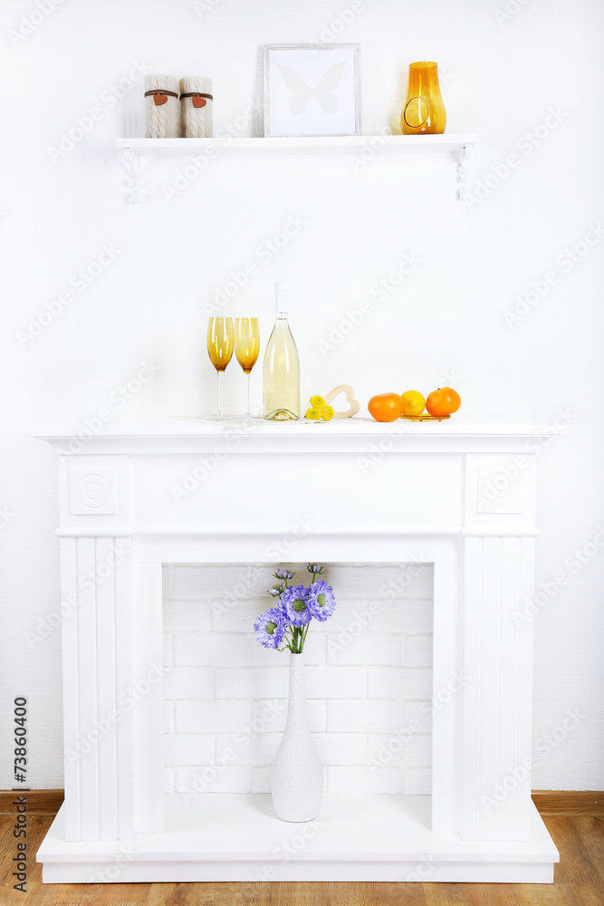 Fireplace with beautiful decorations in comfortable living room