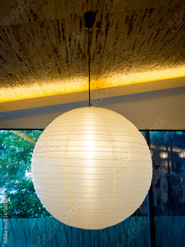 One Warmly Colored Balloon White Paper Lanterns Hanging From The
