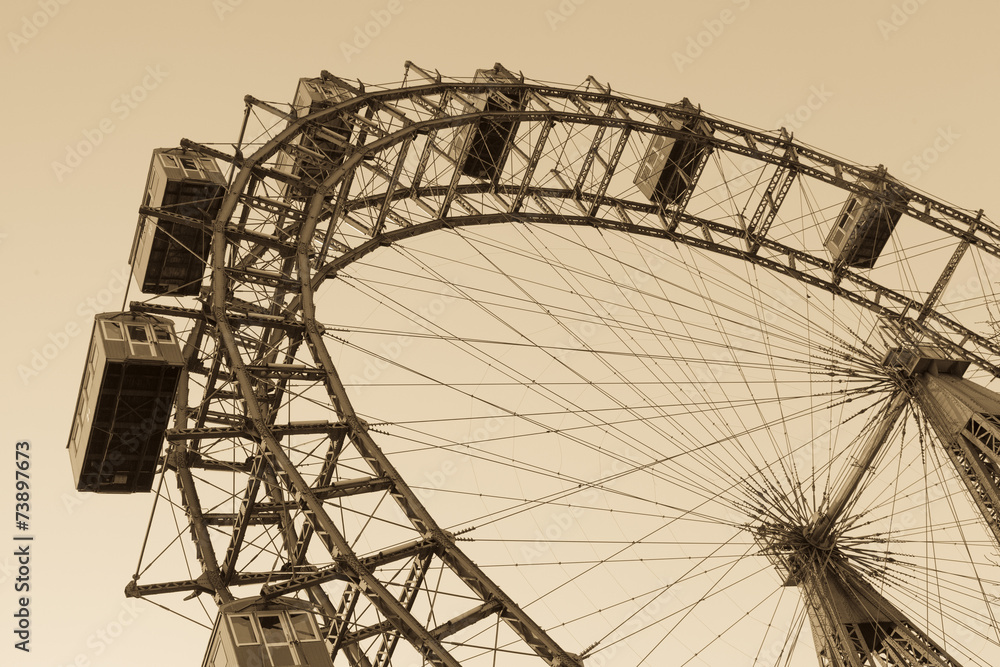 Old ferris wheel in Prater park in Vienna, sepia - obrazy, fototapety, plakaty 