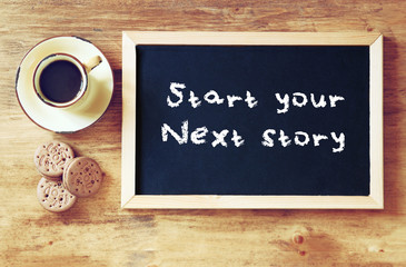 Wall Mural - top view of blackboard with the phrase start your story today ne