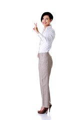 Canvas Print - Full length businesswoman showing OK sign