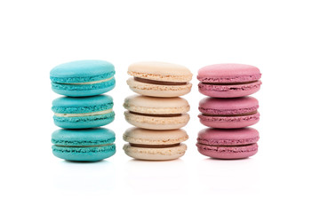 three stackes of multicolored macaroons isolated