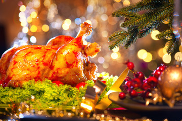 Wall Mural - Christmas dinner. Holiday decorated table with roasted turkey