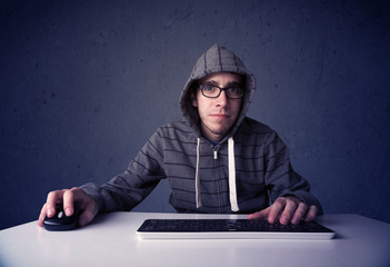 Fototapete - Hacker working with keyboard on blue background