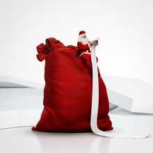 Santa Sitting On Huge Sack And Reading Long List