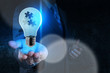 © everythingpossible - businessman hand shows light and puzzle partnership