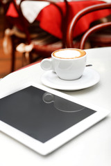 Wall Mural - Woman with tablet computer in cafe shop