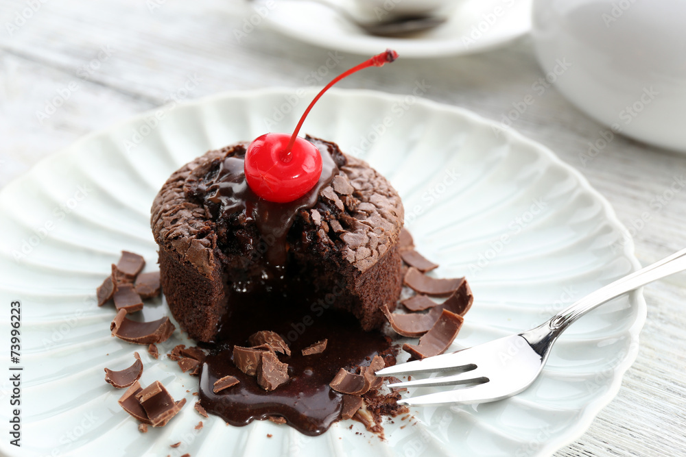 Hot chocolate pudding with fondant centre on plate, close-up