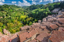 View Of A Green Valley In Sorano Over Red Roofs, Italy