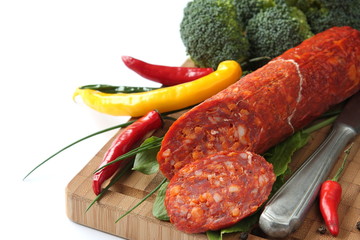 Wall Mural - Spanish chorizo sausage with chili peppers and broccoli