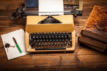 old typewriter, a pile of books and a lot of creativity