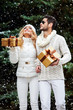 © ASjack - Happy couple near a Christmas tree. Christmas Eve.