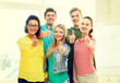 © Syda Productions - five smiling showing thumbs up at school