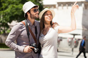 Wall Mural - Tourists walking in a city