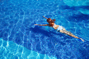 Wall Mural - Beautiful woman in pool