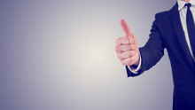 Businessman Giving A Thumbs Up Gesture In A Business Motivation