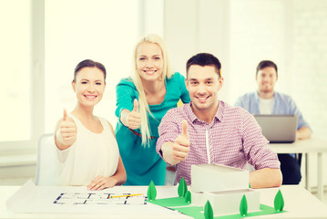 Canvas Print - smiling architects working in office