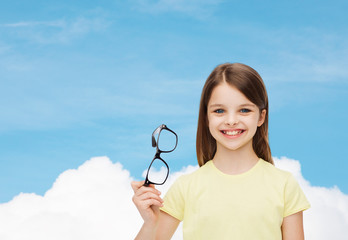 Sticker - smiling cute little girl holding black eyeglasses