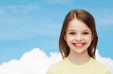 Canvas Print - smiling little girl over white background