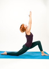 Wall Mural - Yoga posing on a gray studio background