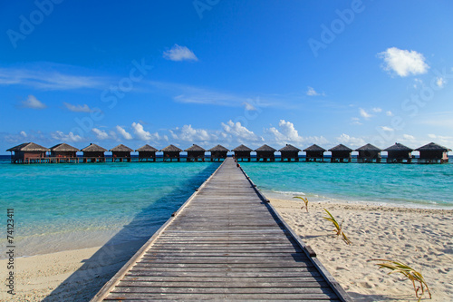 Fototapeta na wymiar water villas in tropical resort