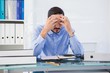 © WavebreakMediaMicro - Stressed businessman with hands on his head