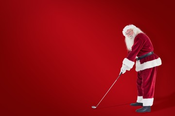 Poster - Composite image of santa claus is playing golf