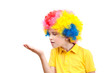 © anrymos - The boy in clown wig blowing on the palm