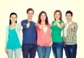 Wall Mural - group of smiling students showing thumbs up