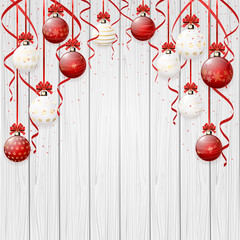 Wall Mural - Red Christmas balls on wooden background