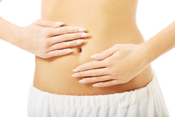 Poster - Close up on woman massaging slim belly