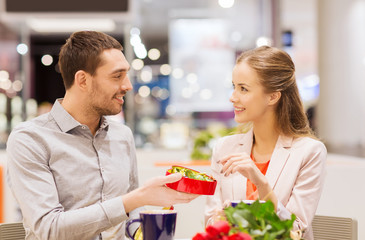 Sticker - happy couple with present and flowers in mall