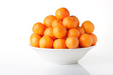 Many Clementines In A White Fruit Bowl - Isolated